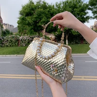 2022 summer new bag female pearl hand held clip bag korean version of a niche design one shoulder cross body bag dinner bag