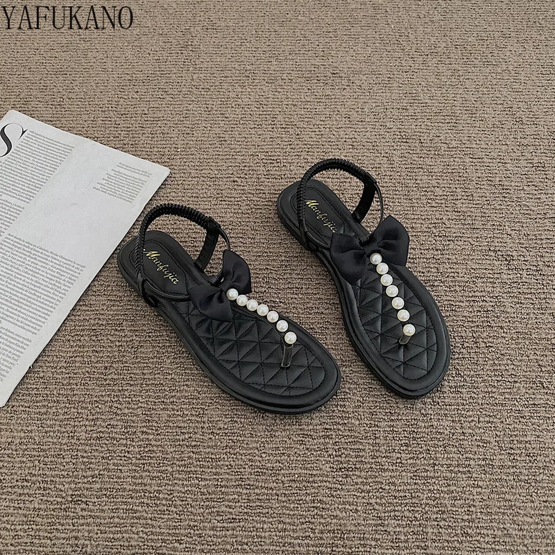 

Roman Sandals Womens 2022 Summer New Flat Bottom Pearl Bow Thong Womens Shoes Retro Niche Outdoor Casual Beach Shoes Bohemian