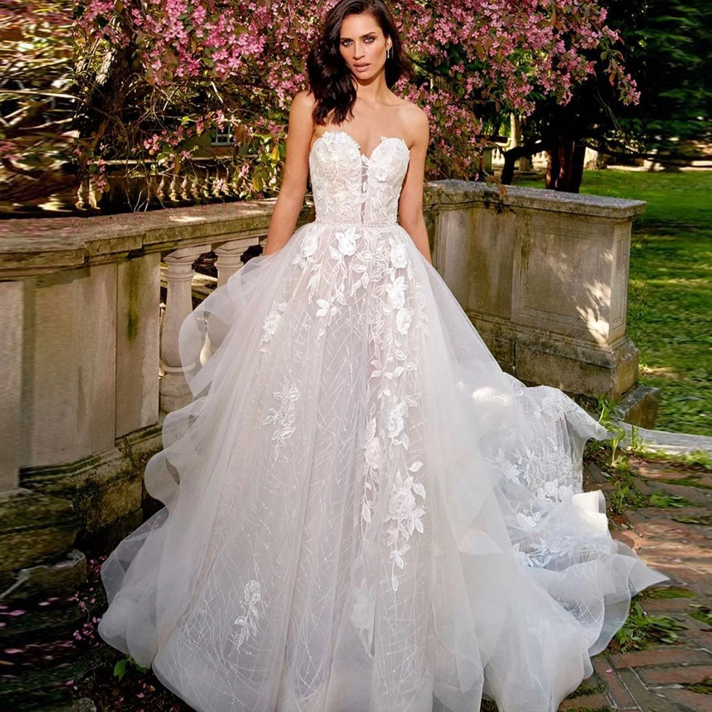 

Gorgeous Wedding Dresses Sweetheart Sleeveless Lace Appliques Wedding Gowns Sequins Beads Backless Sweep Train Tulle Bride Gown