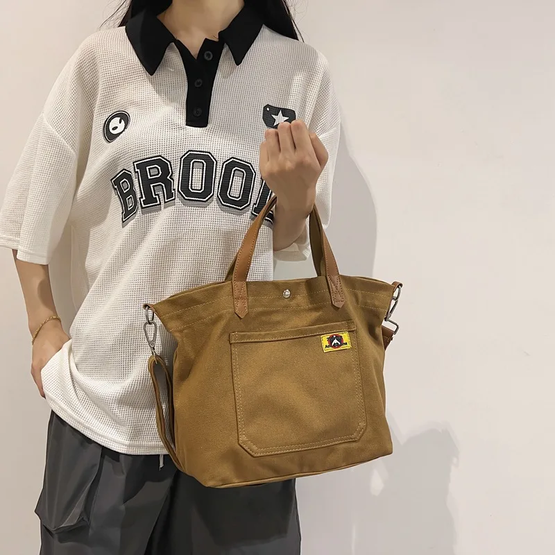 

2021 New Fashion Trend Canvas Bag Work to Work Japan South Korea Daily Commuter Tote Women's Handheld Fabric Bag Shoulder 2022