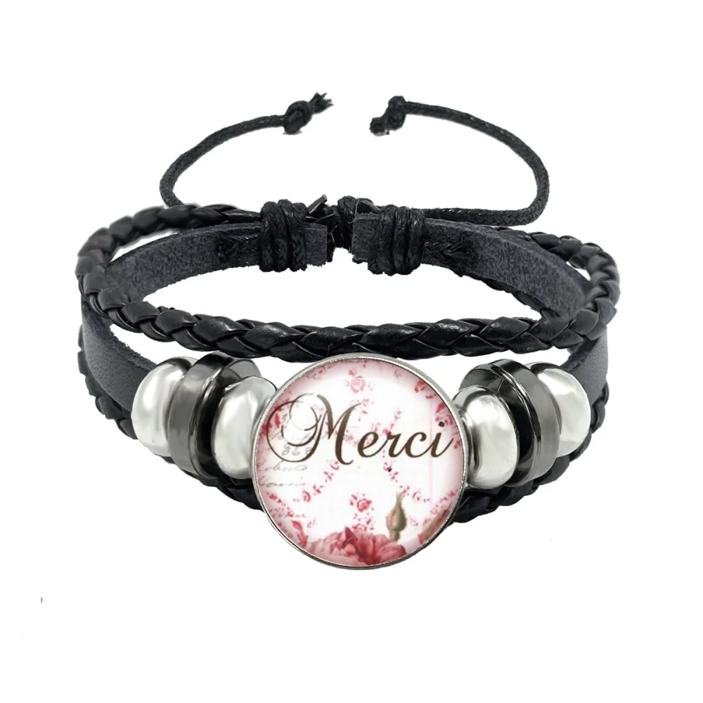 Фото Подарок учителю Merci Maitresse: браслеты из черной кожи с стеклянным кабошоном, украшенные подвесками ко Дню учителя, в знак благодарности. №4