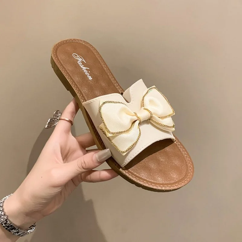 

Женская обувь 2023, модные женские тапочки, летние однотонные шлепанцы с бантом-бабочкой, новые шлепанцы на плоской подошве с круглым носком