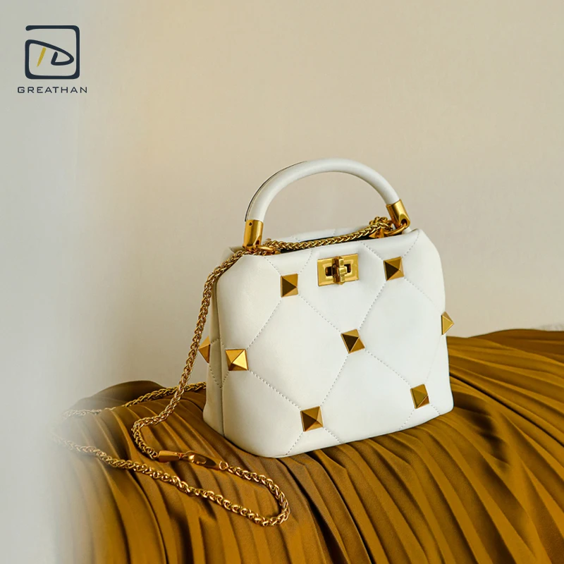 

GreatHan Quilted Leather Handle Bag With Pyramid Rivets Twist Lock