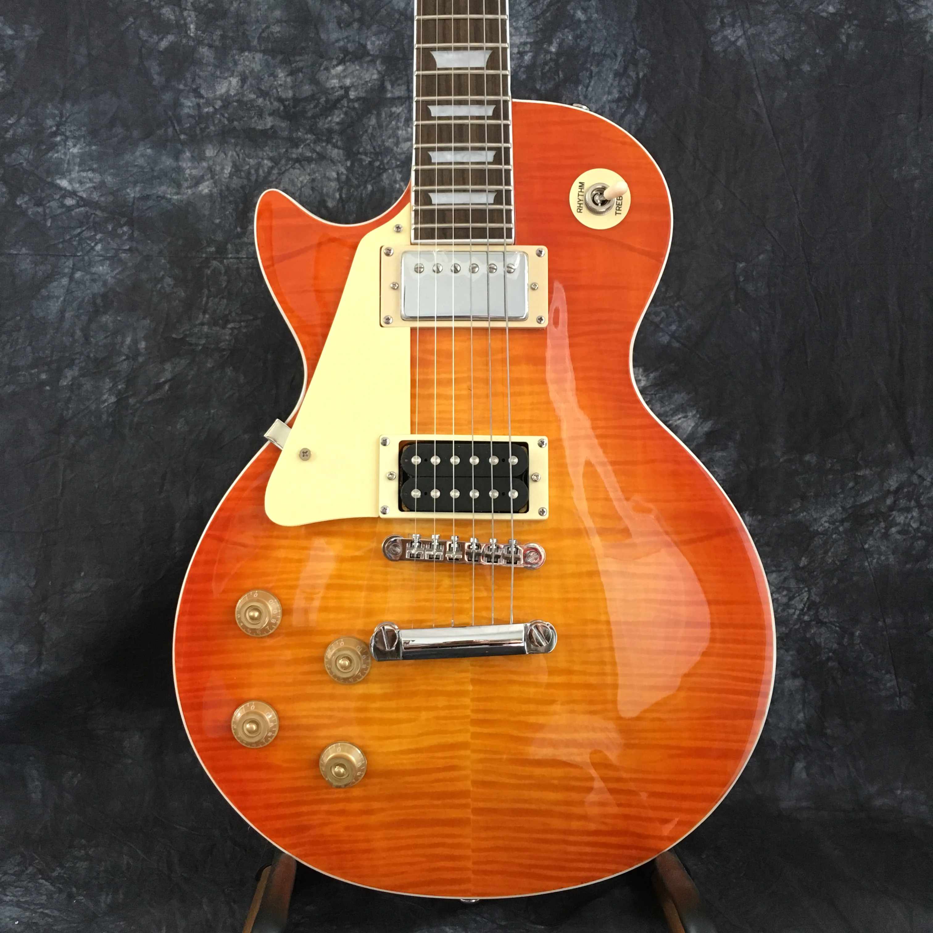 

Hot selling standard electric guitar, left-handed lp guitar, high quality striped tiger maple, mahogany neck wood. free shipping