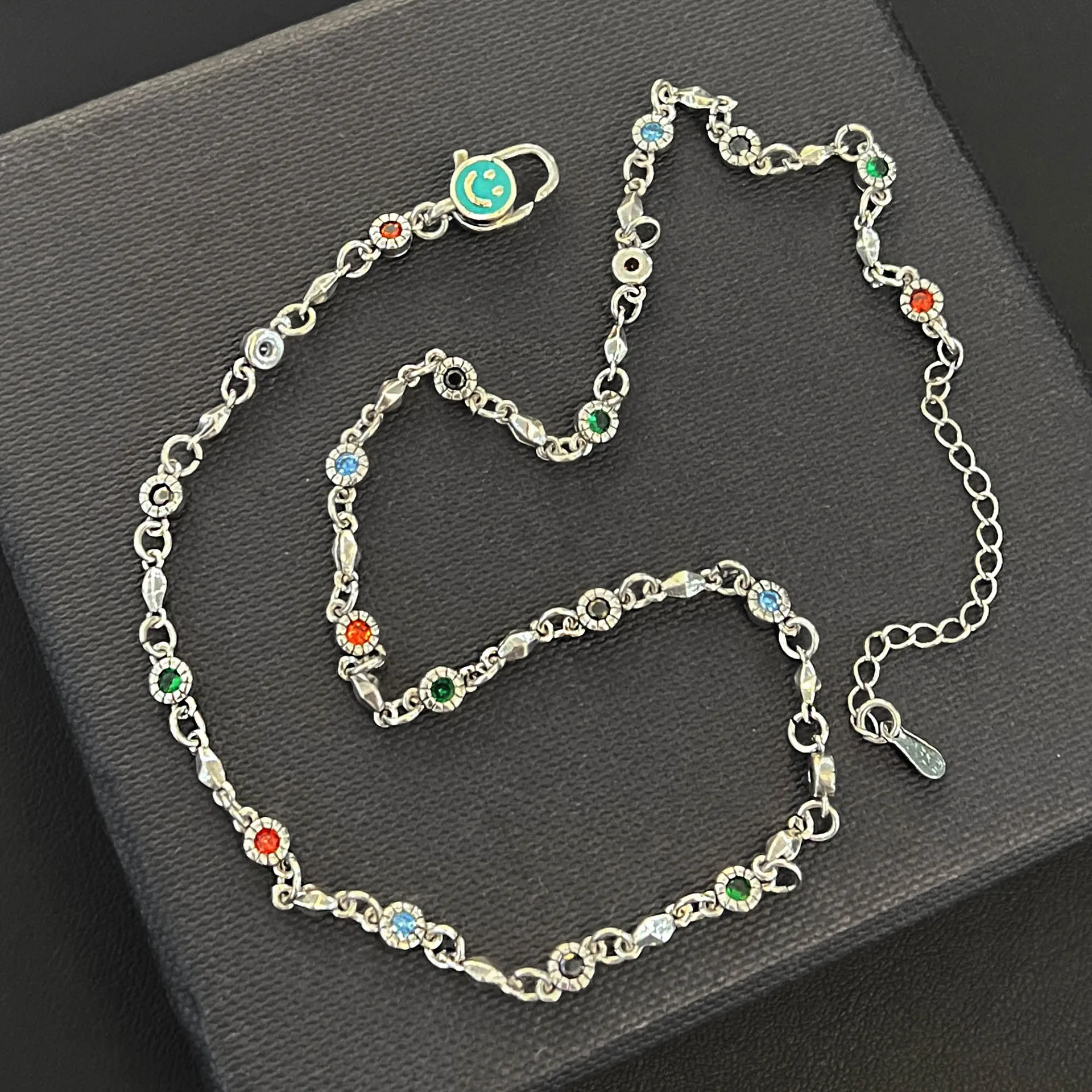 

Vintage Thai silver distressed colored diamond drip gum smiley face button sweater chain design niche cold wind necklace woman