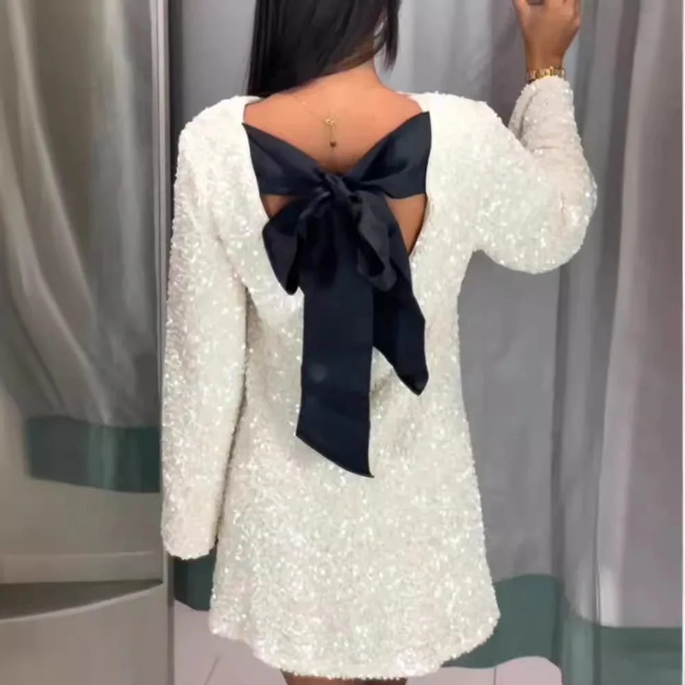 Женское вечернее платье с бантом и блестками