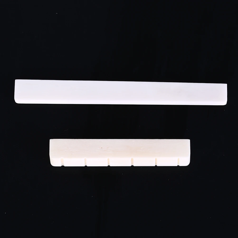 

Guitar Universal Bull Bone Pillow Bone Nut Size 52mm X 6mm X 9/8.5mm And Lassical Guitar Bone Bridge Saddle