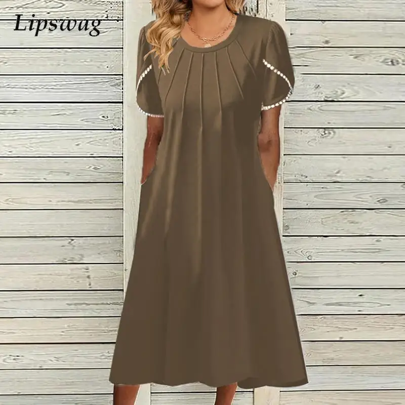 

Женское винтажное платье с круглым вырезом, коротким рукавом и карманами