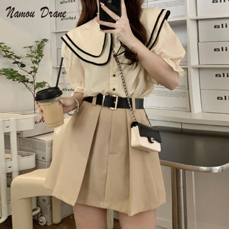 

Namou Drane Summer 2022 New Preppy Double Layer Baby Collar Short Sleeve Top + High Waist Mini Skirt Two-piece Set