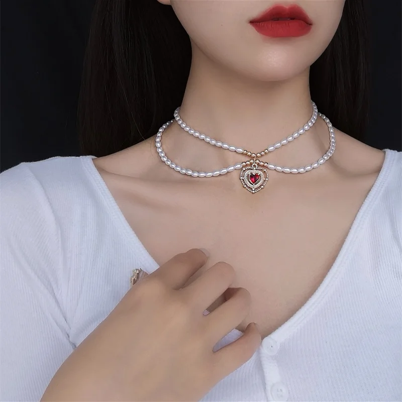 

Japanese and Korean retro new French elegant pearl necklace for women love pendant clavicle chain
