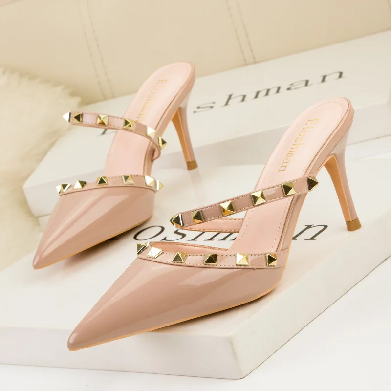 

Summer Sexy Thin High Heels Shallow Mouth Pointed Toe Hollow Metal Rivet Women's Shoes One Word Patent Leather Sandals
