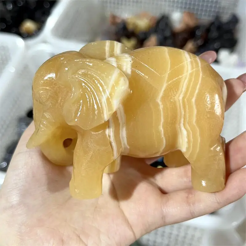 

Натуральный оранжевый кальцит фигурки слона 1 шт.