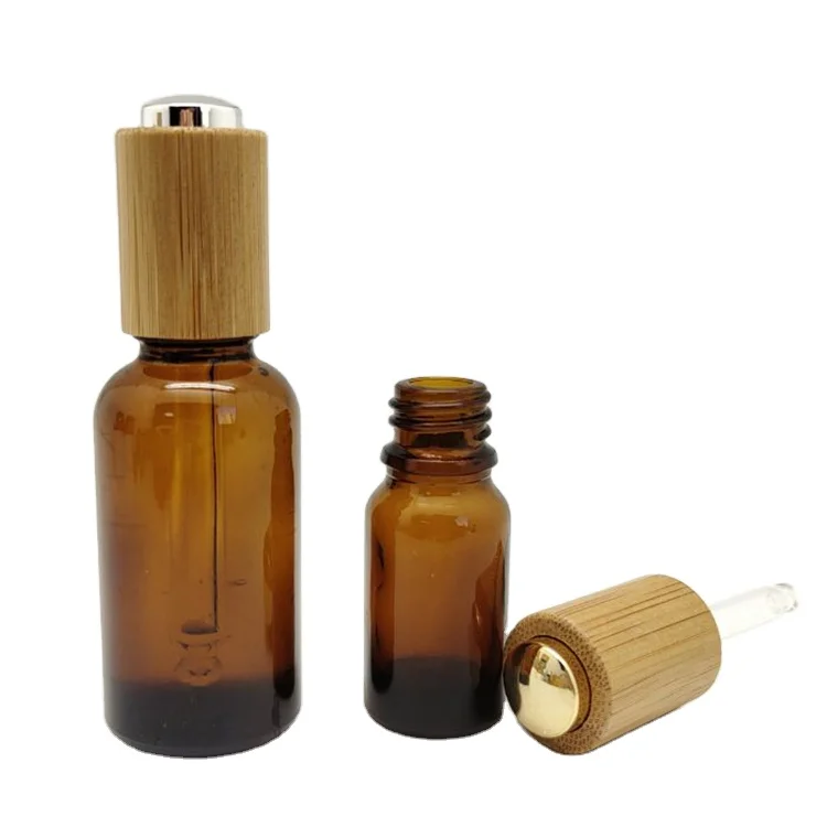 

Wholesale Glass Dropper Bottle Amber Essential Oil With Bamboo Lids 5ml 10ml 15ml 20ml 30ml 50ml 100ml Empty Cosmetics Packaging