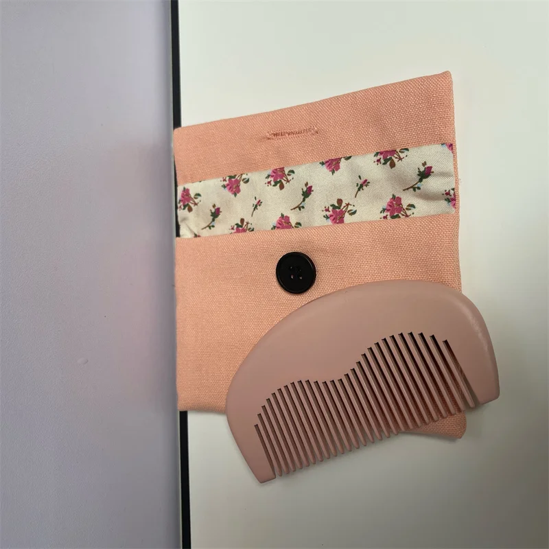 

Brand name pink mini beauty hair wood comb