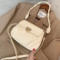 2020 new trendy one shoulder messenger bag on the new french niche design soft leather peach heart buckle pleated small round ba