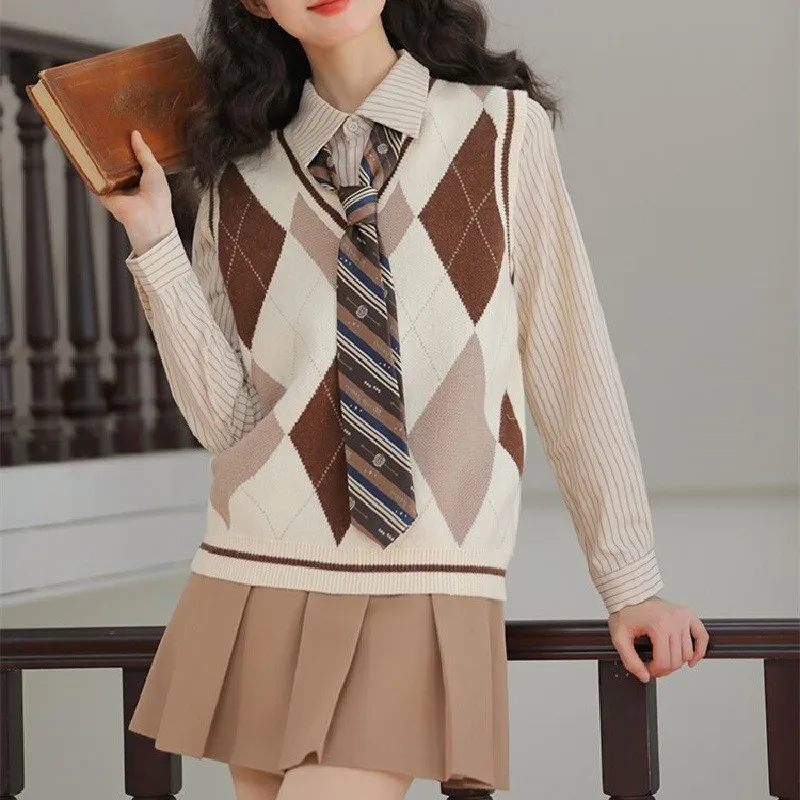 

Vintage College Style Set 2023 Layered Knitted Vest + Apricot Stripes Long Sleeve Shirt + Women's Kahki Pleated Skirt 3pcs Suit