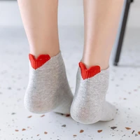 womens socks in a solid color with a heel heart