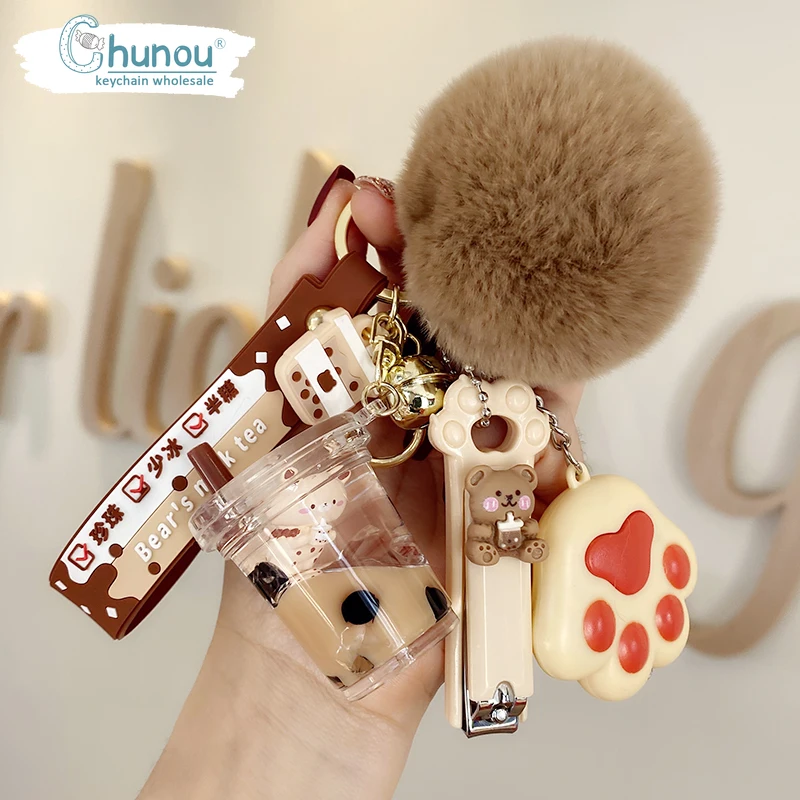 2022New Girl Creative Crystal Milk Tea Cup Leather Rope Key ring Cartoon Hair Ball Nail Clipper Bag Pendant Car Key chain Female