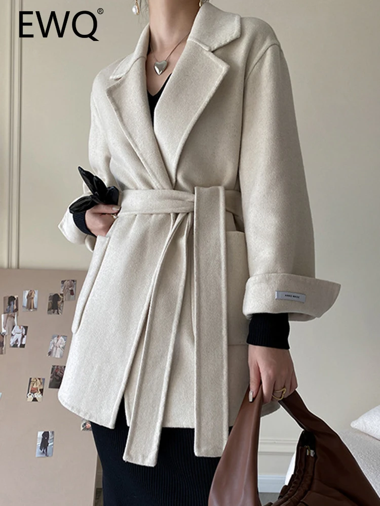 

Женское шерстяное пальто с поясом, длинным рукавом и отворотом