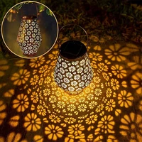 solar light outdoor led metal solar lantern light outdoor hanging hollow lantern light flower shadow waterproof garden lamp
