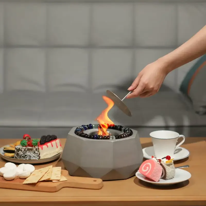 

Stylish Gray Tabletop Fire Bowl, Clean-Burning, Indoor-Outdoor Alcohol Fire Pit Fireplace for Enhancing Your Home Decor.