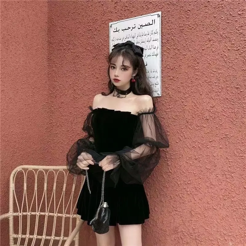 

2023 Spring and summer temperament mesh gauze bubble sleeve black skirt off-shoulder fungus tucked waist pommel dress women's we
