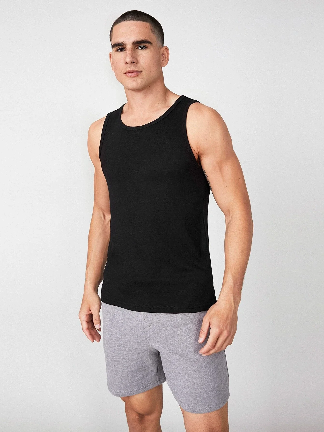 

t shirt for men BASICS Men Solid Tank Top