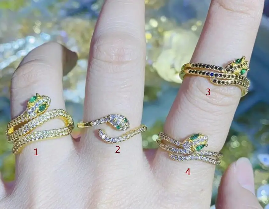 

Женское кольцо в виде змеи, золотистого цвета с фианитом, 1 шт.