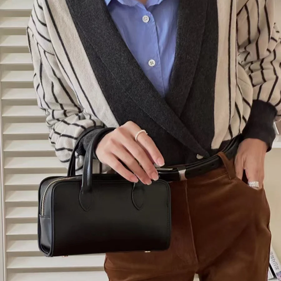 

Europe and the United States new fashion women's handbag niche design senior sense briefcase leather retro Boston pillow bag