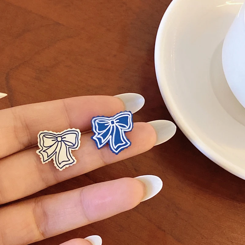 

Modern Jewelry Sweet Bowknot Earrings Hot Sale Elegant Design Sweet Korean Style Asymmetrical White Blue Stud Earrings Gifts