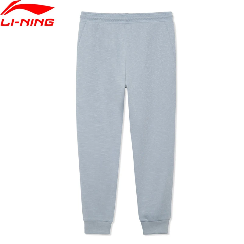 

(Распродажа) Li-Ning женские тренировочные спортивные брюки 65% полиэстер 35% хлопок Свободные теплые флисовые зимние брюки с карманами AKLR884