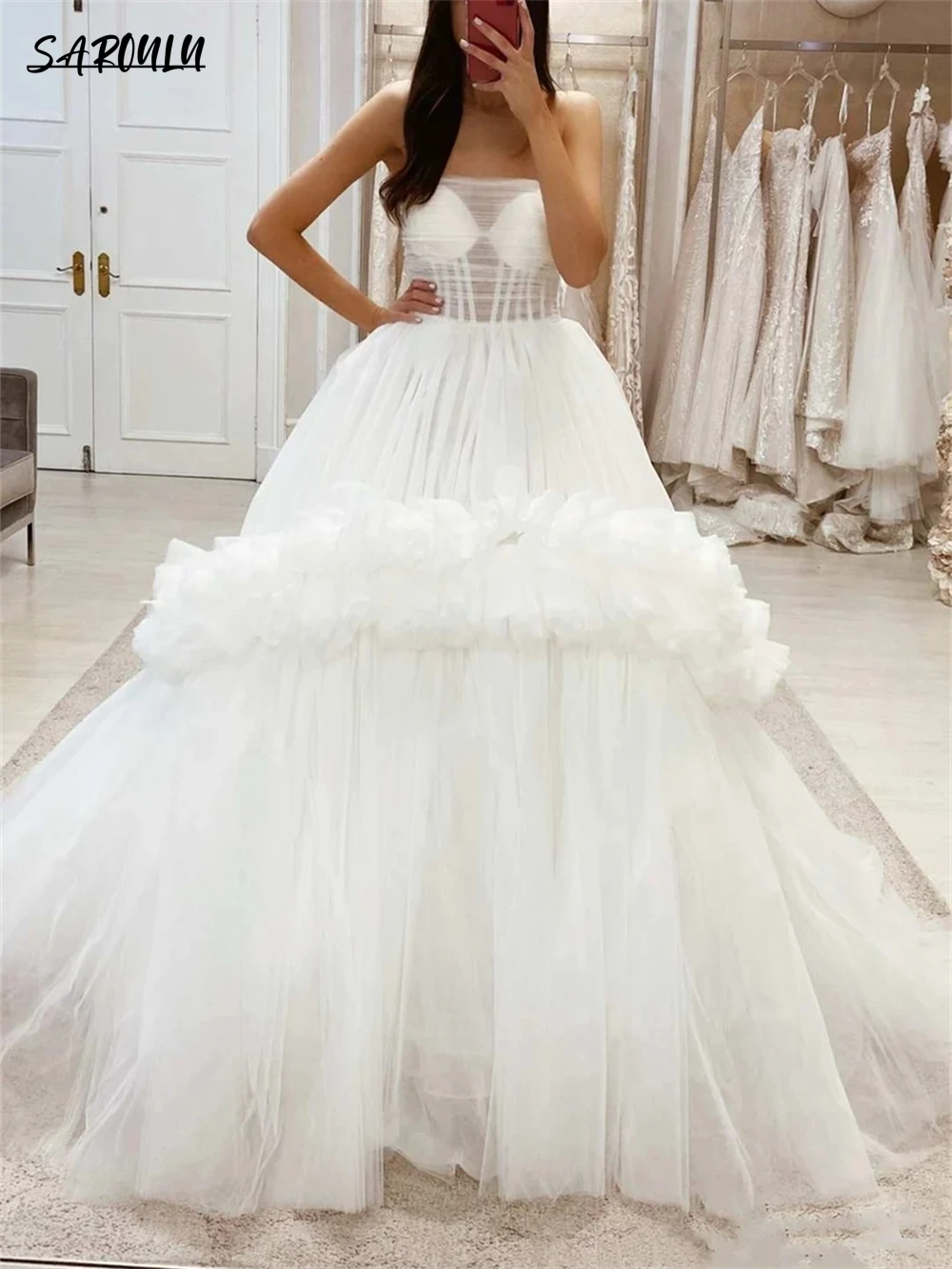 

White Tulle Long Wedding Dress Features Strapless Neckline A-line Tiered Skirt With Ruffles Bride Dresses Bridal Gown