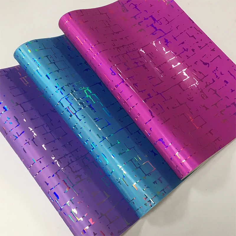 

Holographic Texture Embossed Metallic Laser Mirror Effect PU Faux Leather Fabric for Shoe/Bag/Handbag/Decoration