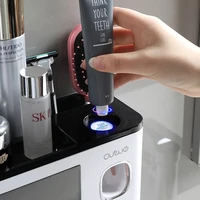 2 cups new magnetic toothbrush holder for bathroom accessories automatic toothpaste squeezer dispenser wall mounted storage rack