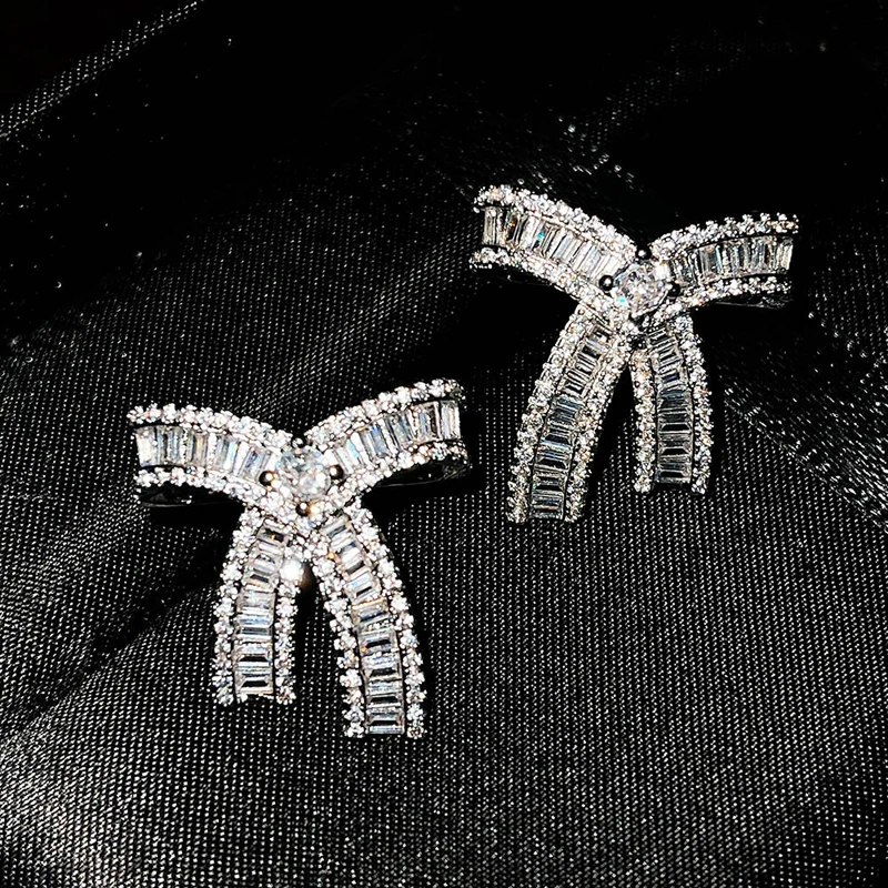 

Изысканные серьги-гвоздики с бантом, полная инкрустация, ослепительный маленький циркон ААА, элегантные ювелирные изделия для пирсинга для...