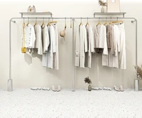 stainless steel womens clothing store shelves are hung on the walls of high end clothing store display shelves