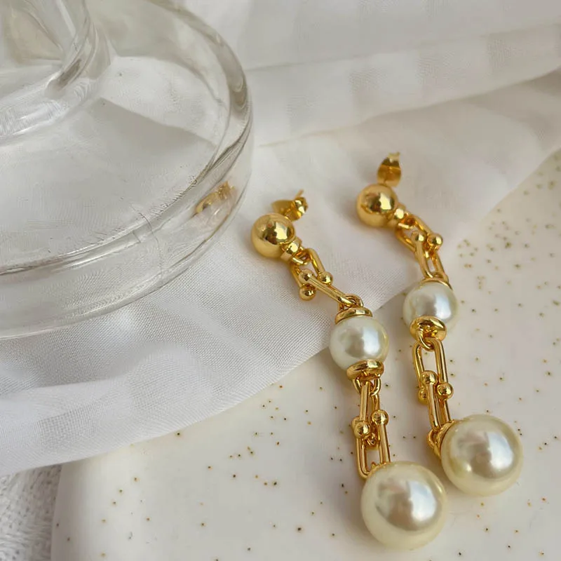 

Женские серьги-гвоздики с искусственным жемчугом