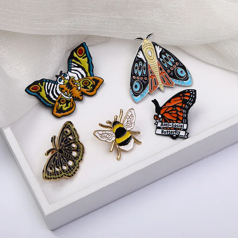 

New Butterflys Bee Enamel Pins Custom Lily of the Valley Vine Brooches Lapel Badge Black Insect Plant Jewelry Gift for Friends