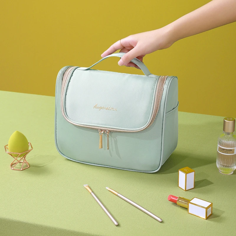 

2022 New Portable Makeup Bag Large Capacity Portable Solid Color Hook Wash Bag Korean Cosmetic Storage Bag Travel Storage Bag