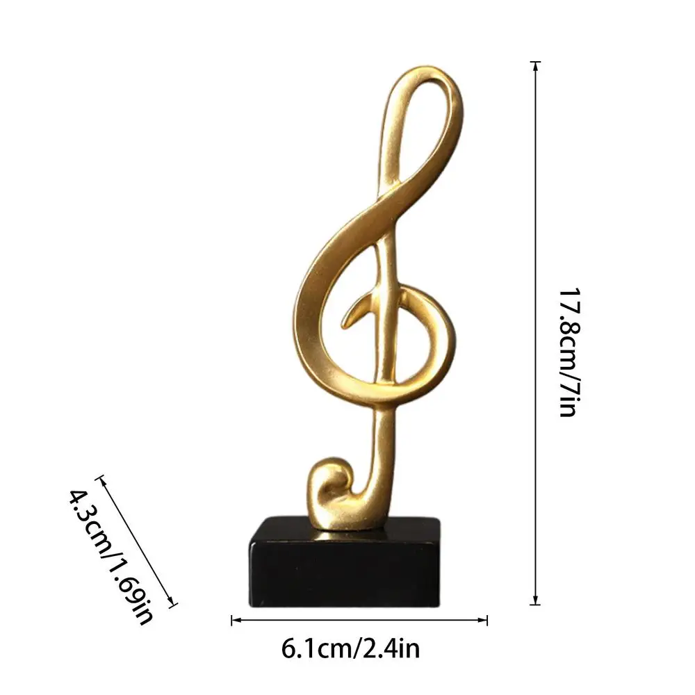 

Золотые фигурки музыкальных нот из полимера