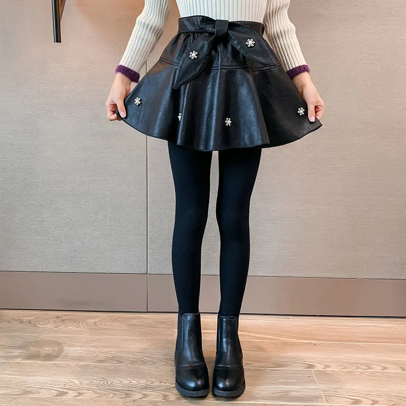 

Детские черные леггинсы для девочек, юбка-штаны на осень и зиму, юбка-штаны с жемчугом, детская юбка из искусственной кожи, хлопковые леггинс...