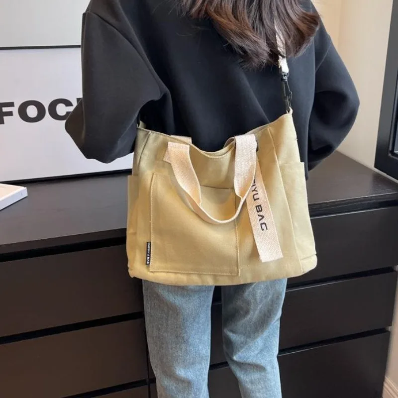 

2023 New Niche Minimalist Canvas Tote Bag for Women's Autumn New High-capacity Commuting Shoulder Bag Casual Handbag
