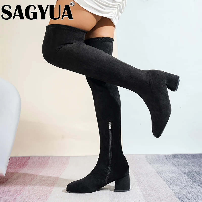 Женские сапоги выше колена на высоком каблуке. Замшевые туфли массивном