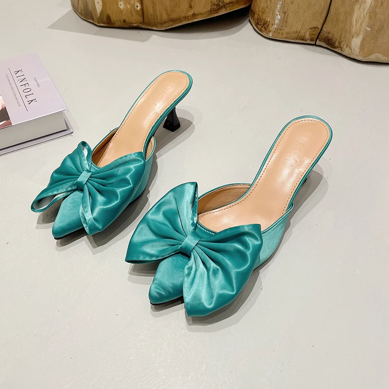

2022 Early Spring New Luxury Shoes Light Cooked Wind Bow Silk Pointed Thin Heel High Heel Sexy Baotou Semi Slippers Women Sandal