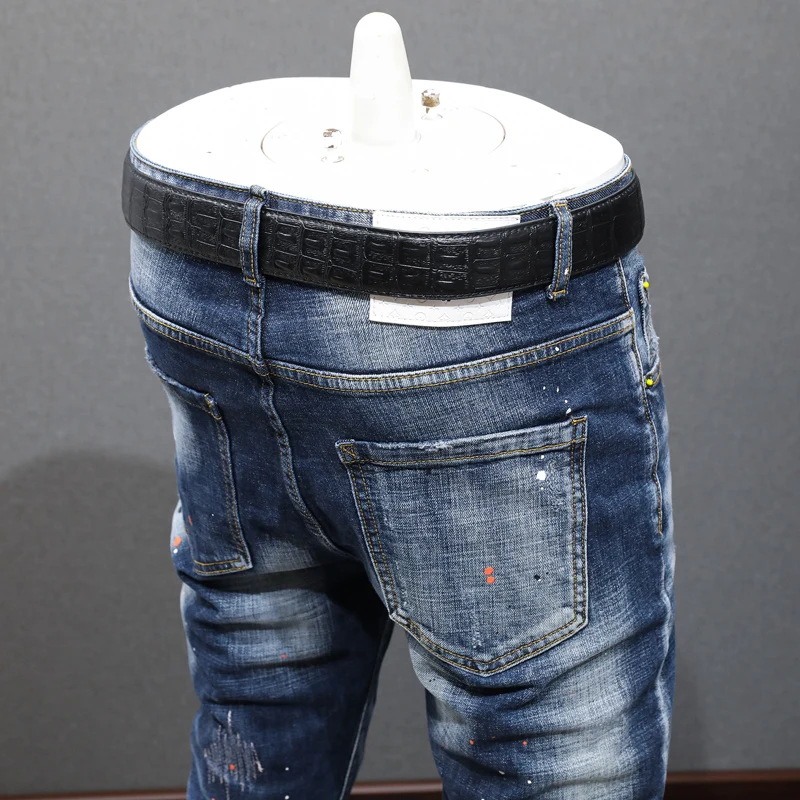 Newly Designer Fashion Men Jeans Retro Blue Elastic Embroidery Slim Ripped Jeans Men Hip Hop Painted Vintage Denim Pants Hombre