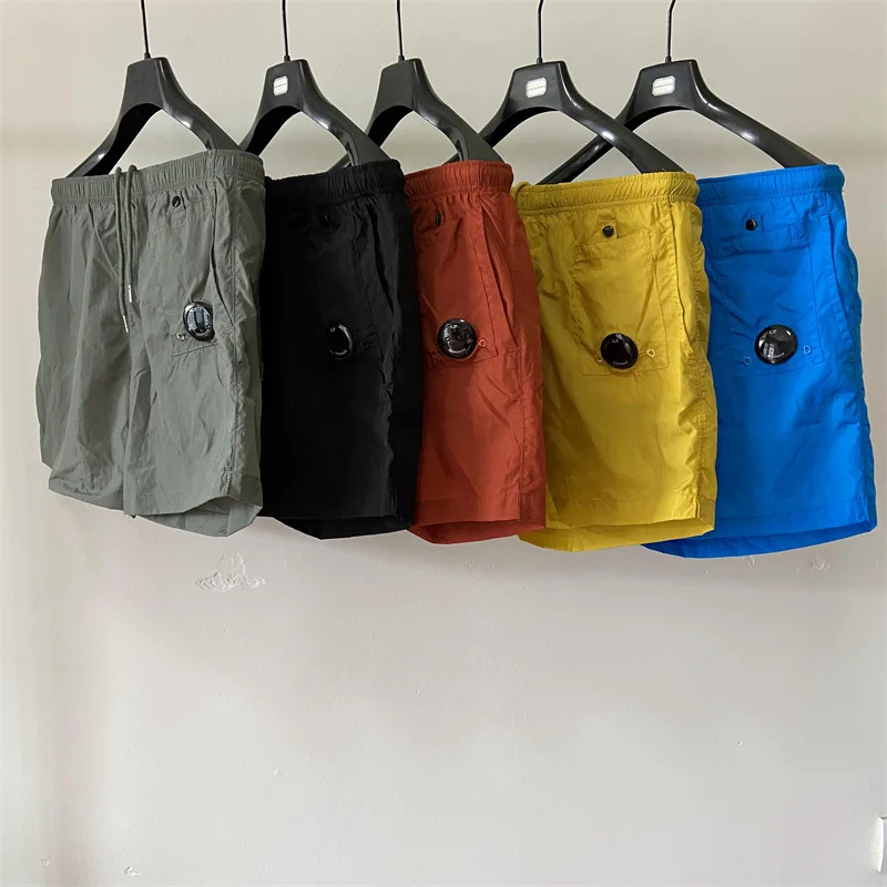 

Summer CP Mens Shorts Fashion Casual Nylon Multi Color Pocket Drawstring Gym Shorts Loose Sports Beach Pants Men Sweatpants 2023