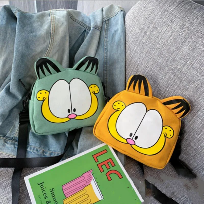 

Hot Cartoon Garfield Canvas Student Creative Trend Versatile Printed Messenger Bag Children's Christmas Holiday Gifts In Stock