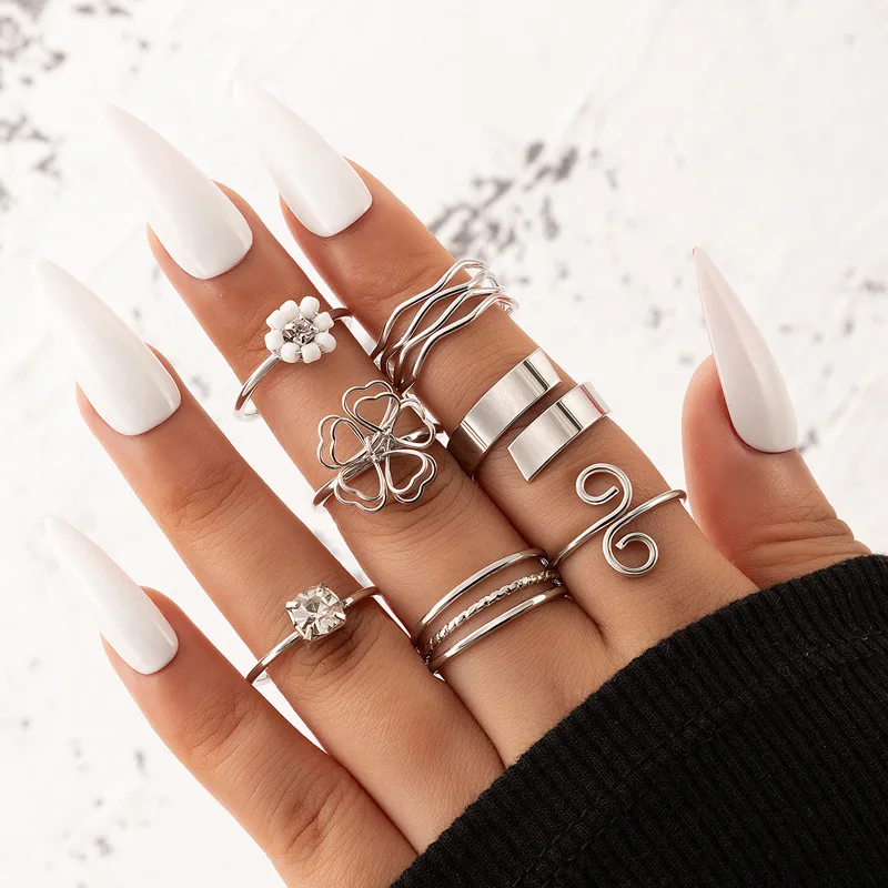 

New 2022 Hollowed-out Flower Rice Bead Seven-piece Ring Set Inlaid With Diamond Geometric Word Ring Set