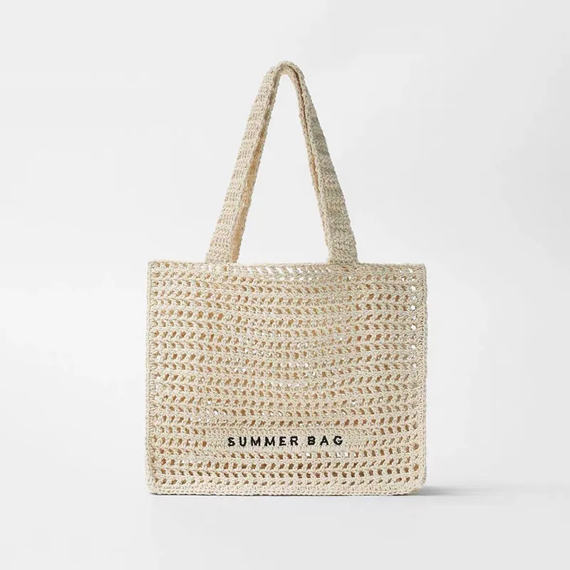 

Summer fairy hollow straw woven bag niche one-shoulder hand-held letter woven bag female seaside holiday beach bag