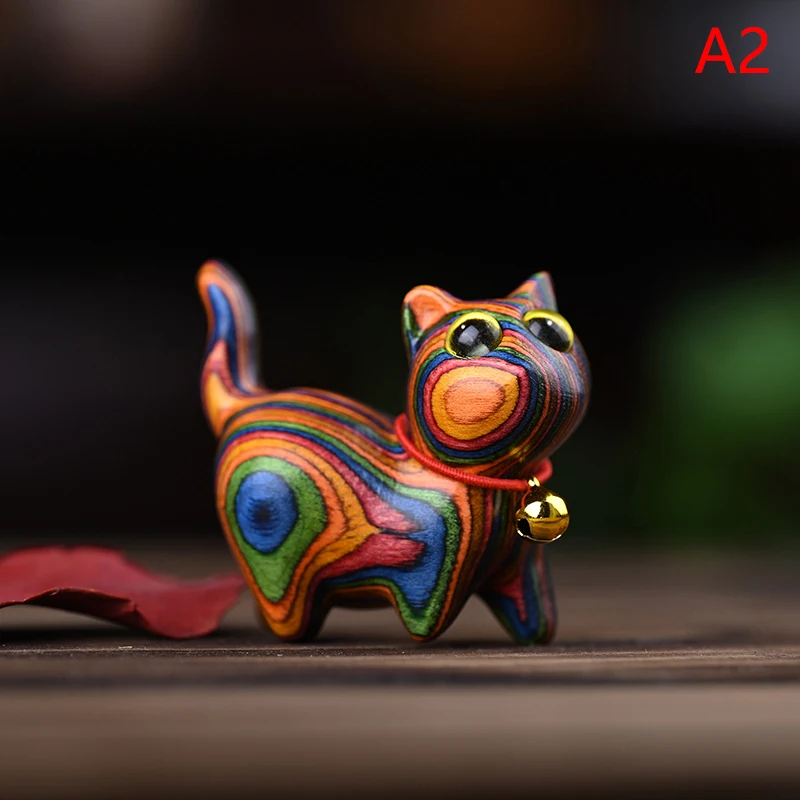 

Радужные фигурки котов из лозы
